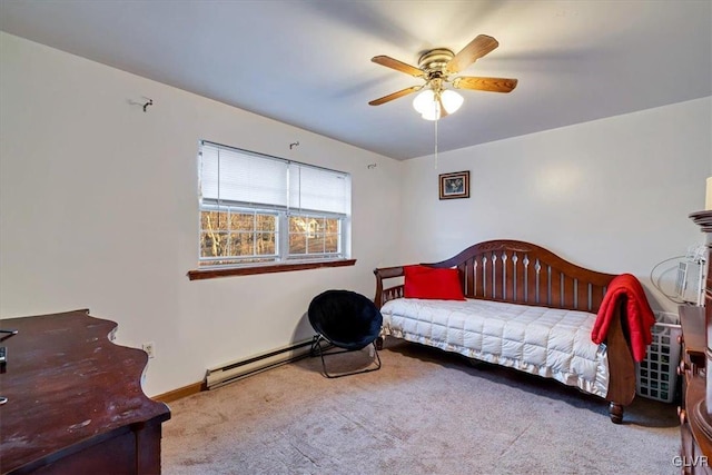 carpeted bedroom featuring ceiling fan and a baseboard heating unit