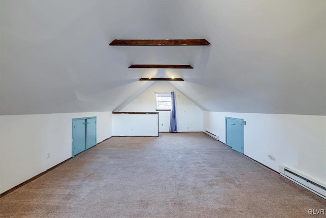 additional living space with vaulted ceiling with beams, light carpet, and a baseboard radiator