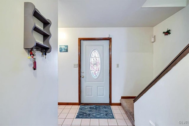 foyer entrance with light tile patterned floors