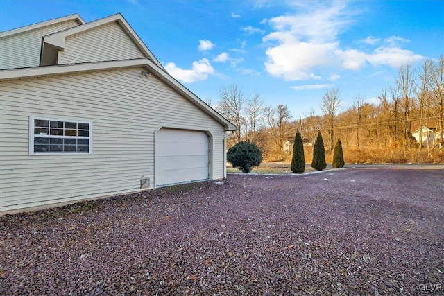 view of side of property featuring a garage