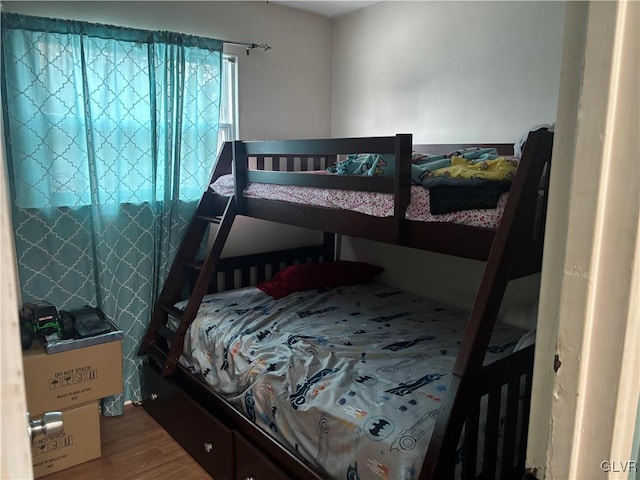 bedroom with hardwood / wood-style floors