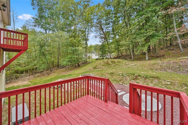 wooden terrace with a lawn