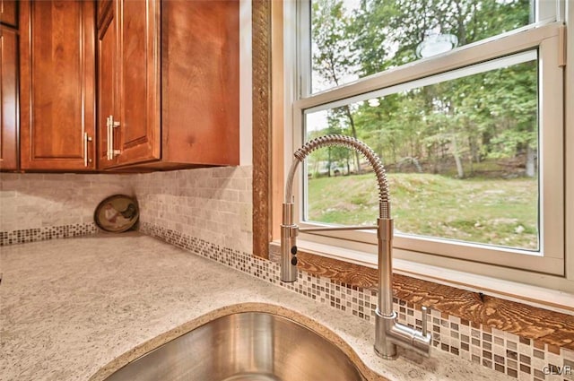 interior details with backsplash and light stone counters