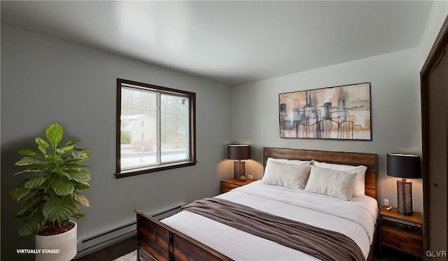 bedroom with a baseboard heating unit