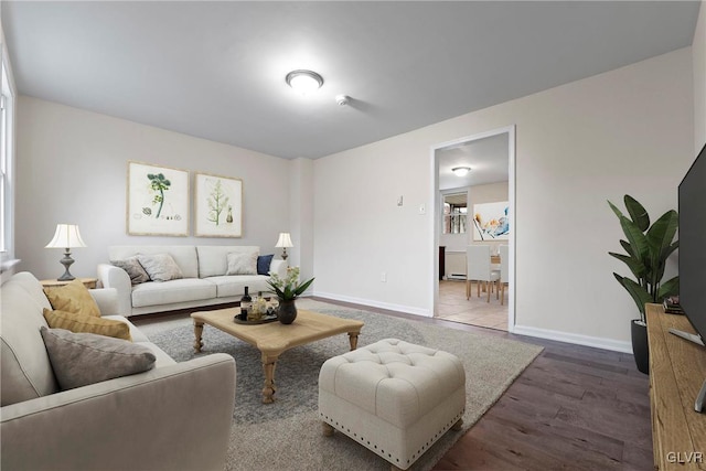 living room with dark hardwood / wood-style flooring