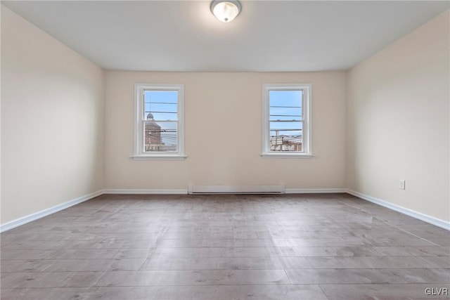 spare room featuring a baseboard radiator