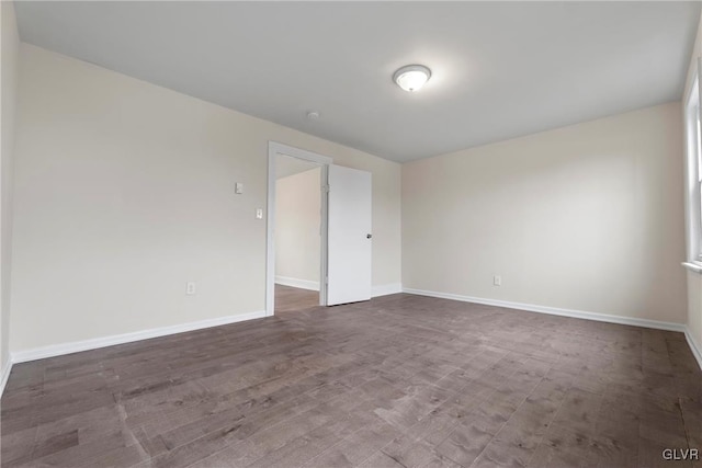 spare room with hardwood / wood-style flooring