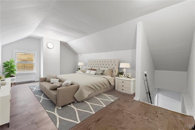 bedroom with wood-type flooring, vaulted ceiling, and a baseboard heating unit