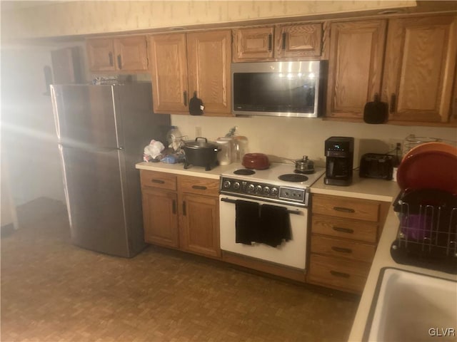 kitchen with sink and appliances with stainless steel finishes