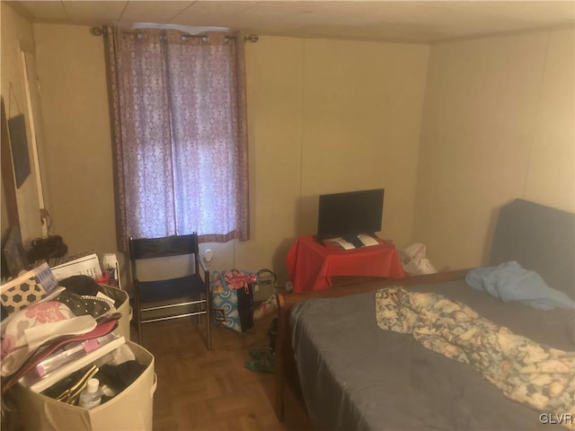 bedroom with parquet flooring