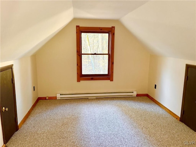 bonus room with lofted ceiling, carpet floors, and a baseboard heating unit