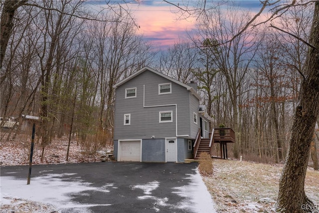 exterior space featuring a deck and a garage