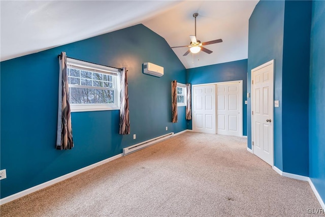 unfurnished bedroom with a baseboard heating unit, vaulted ceiling, ceiling fan, a wall mounted AC, and carpet floors