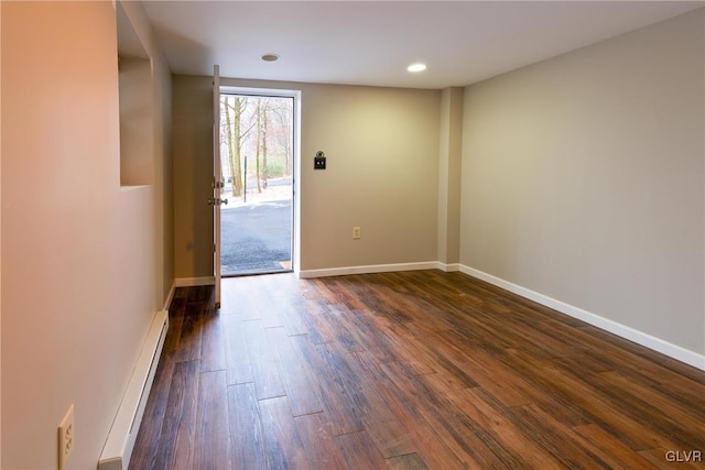 interior space featuring a baseboard radiator and dark hardwood / wood-style floors