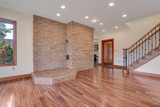 unfurnished living room featuring hardwood / wood-style floors