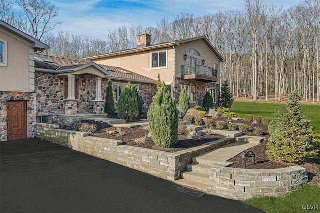 view of front of property with a balcony