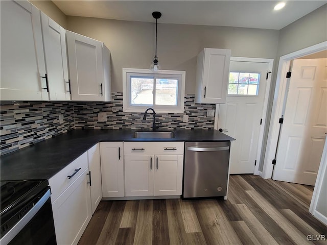 kitchen with white cabinets, dishwasher, sink, and hanging light fixtures