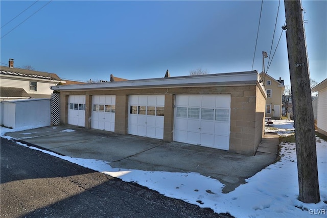 view of snow covered garage