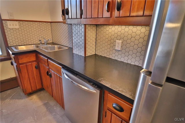 kitchen featuring stainless steel appliances, tasteful backsplash, and sink