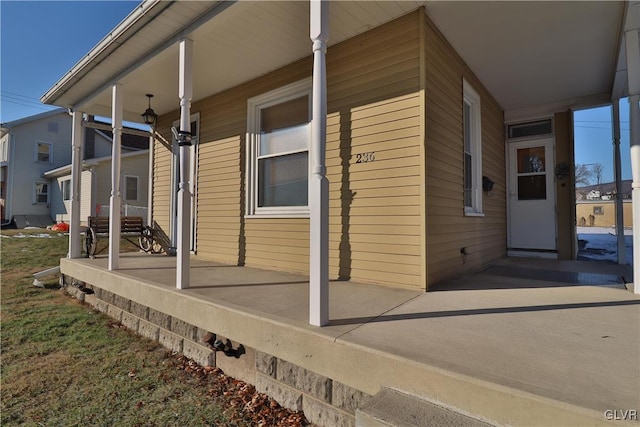 view of property exterior with covered porch