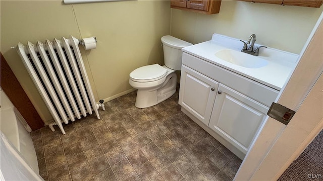 bathroom featuring vanity, toilet, and radiator heating unit