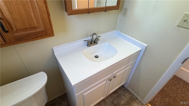 bathroom with vanity and toilet