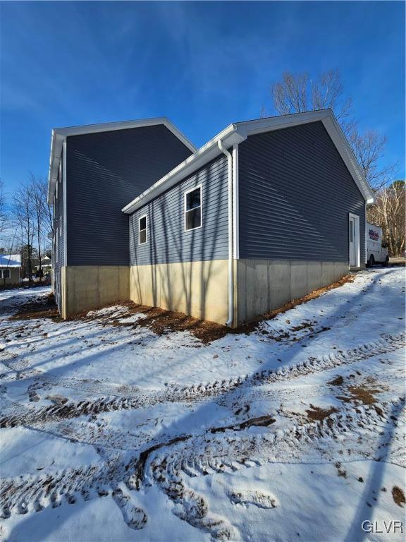 view of snow covered property