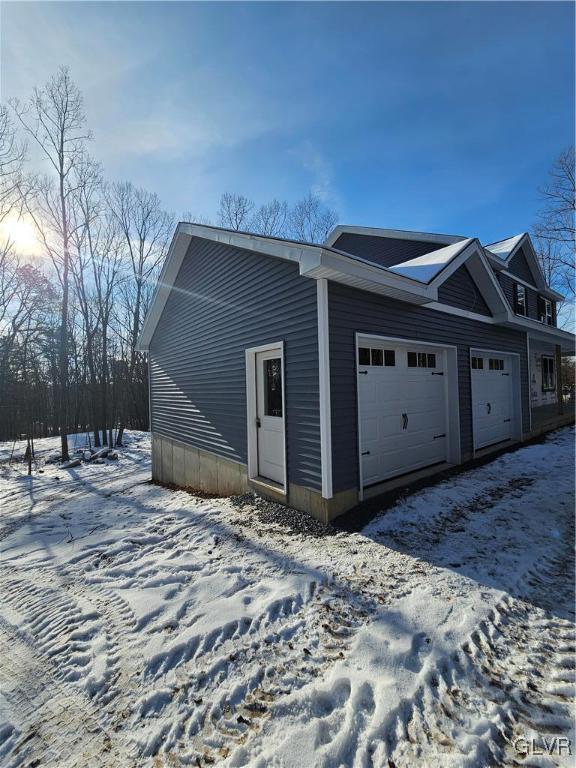 view of snow covered garage