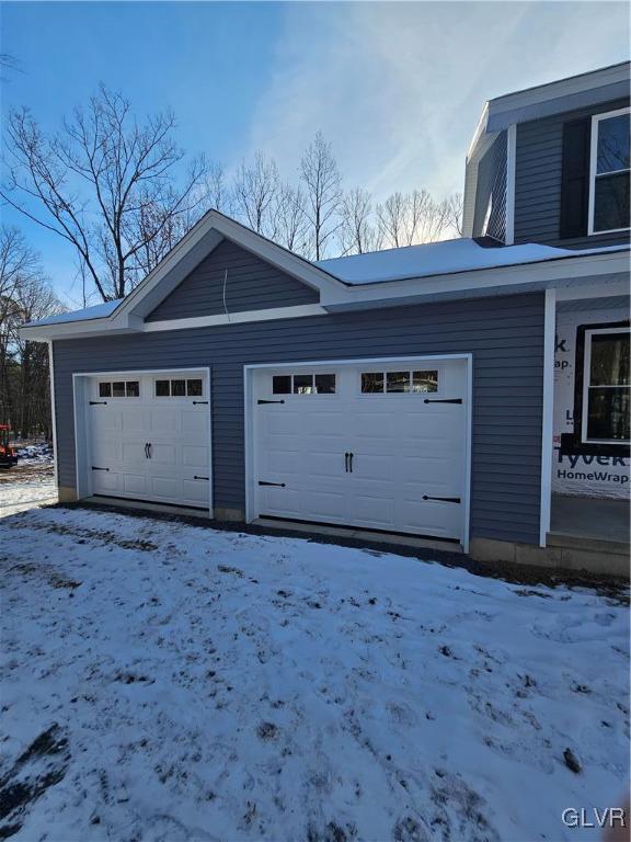 view of snow covered garage