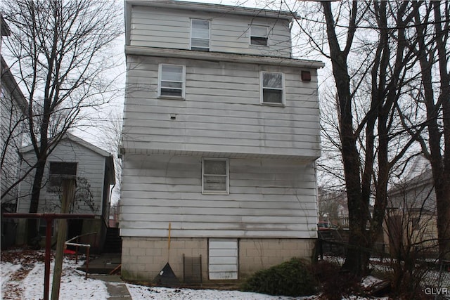 view of snow covered house