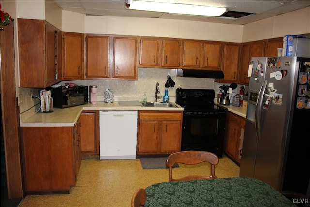 kitchen with black appliances and sink