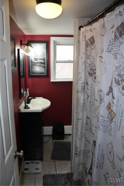 bathroom featuring curtained shower, tile patterned flooring, and vanity