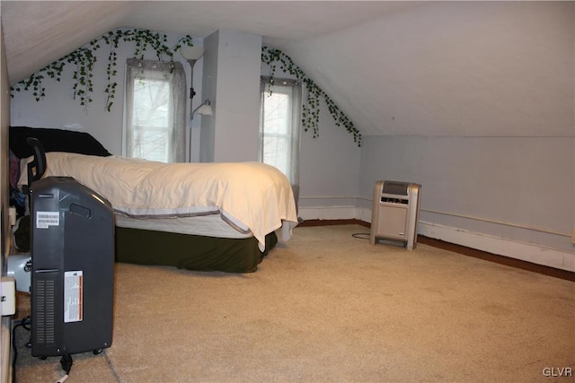 bedroom with light colored carpet and vaulted ceiling