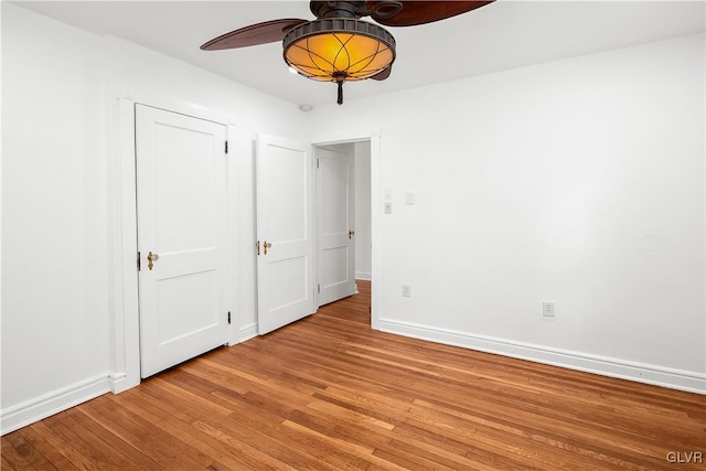 unfurnished bedroom featuring ceiling fan and light hardwood / wood-style flooring