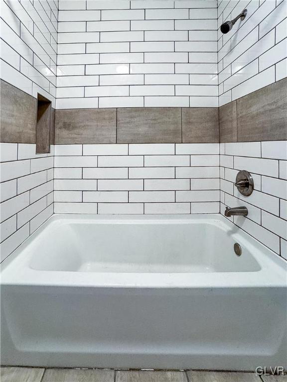 bathroom with shower / bathing tub combination