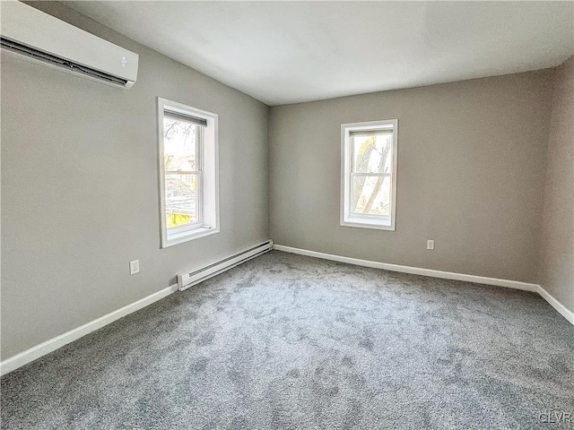 carpeted spare room with baseboard heating and a wall mounted AC