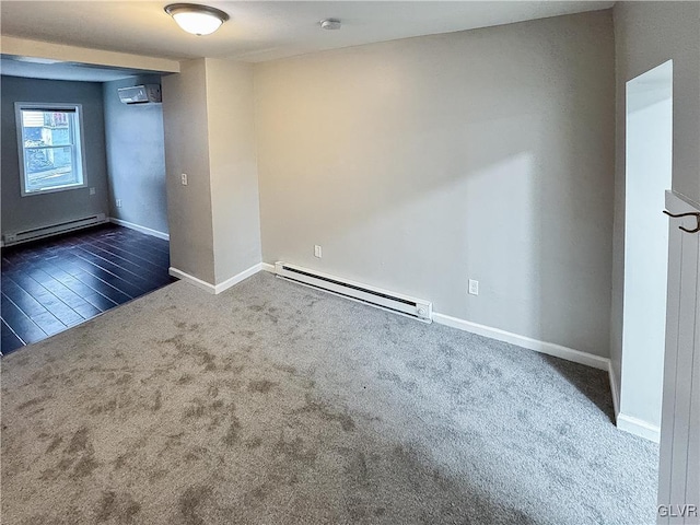 carpeted empty room with an AC wall unit and a baseboard heating unit