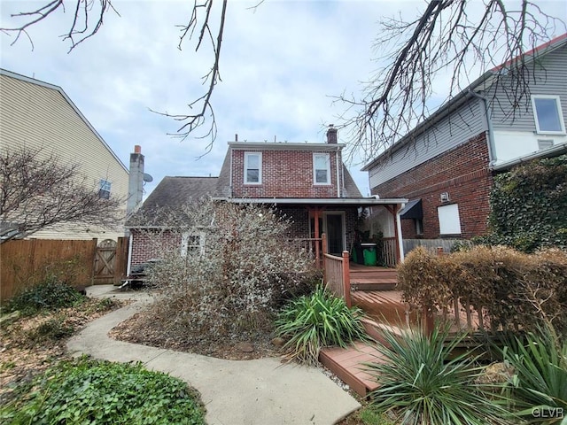 back of property featuring a deck