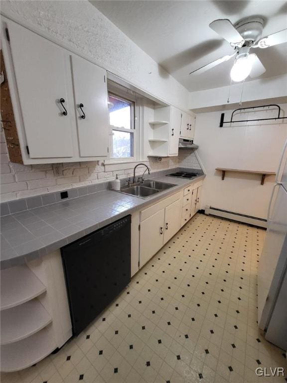 kitchen featuring white cabinetry, tile counters, dishwasher, sink, and a baseboard heating unit