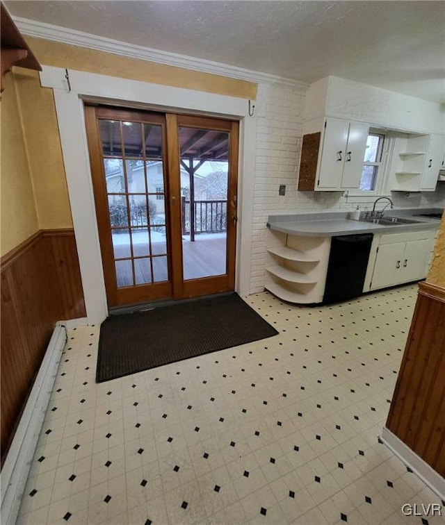 kitchen featuring dishwasher, a healthy amount of sunlight, white cabinetry, and sink