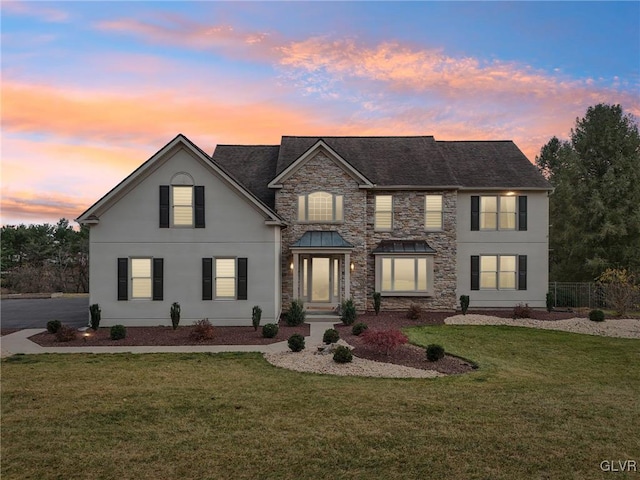 view of front of home featuring a yard