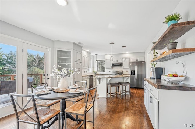 dining area featuring dark hardwood / wood-style floors