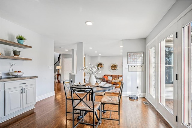 dining area featuring dark hardwood / wood-style flooring