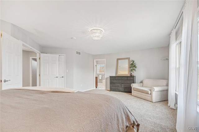 bedroom with light carpet and a closet