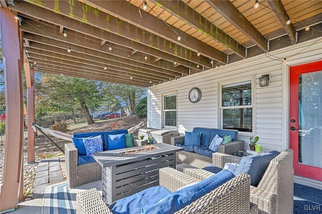 view of patio / terrace with an outdoor living space with a fire pit