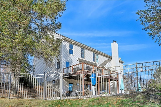 back of house featuring a deck