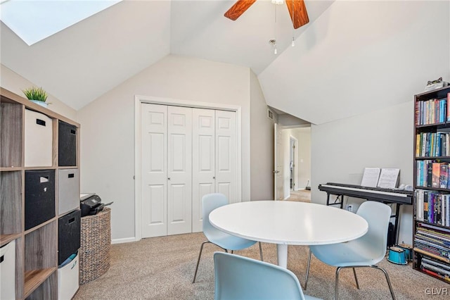 home office featuring ceiling fan, light colored carpet, and lofted ceiling