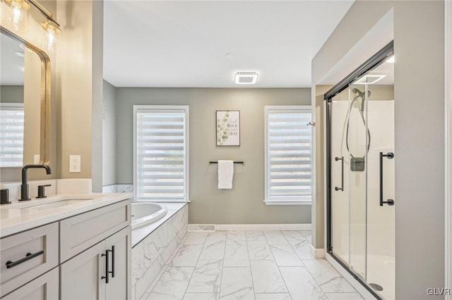 bathroom featuring vanity and separate shower and tub