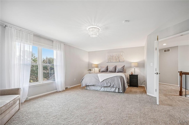 bedroom featuring light colored carpet