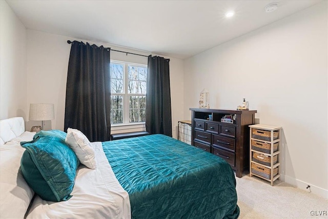 bedroom featuring light colored carpet